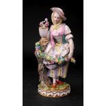 A Meissen figure of a young lady, 19th century,