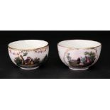 Two Meissen outside decorated tea cups, late 19th century, each painted with figures in a landscape,