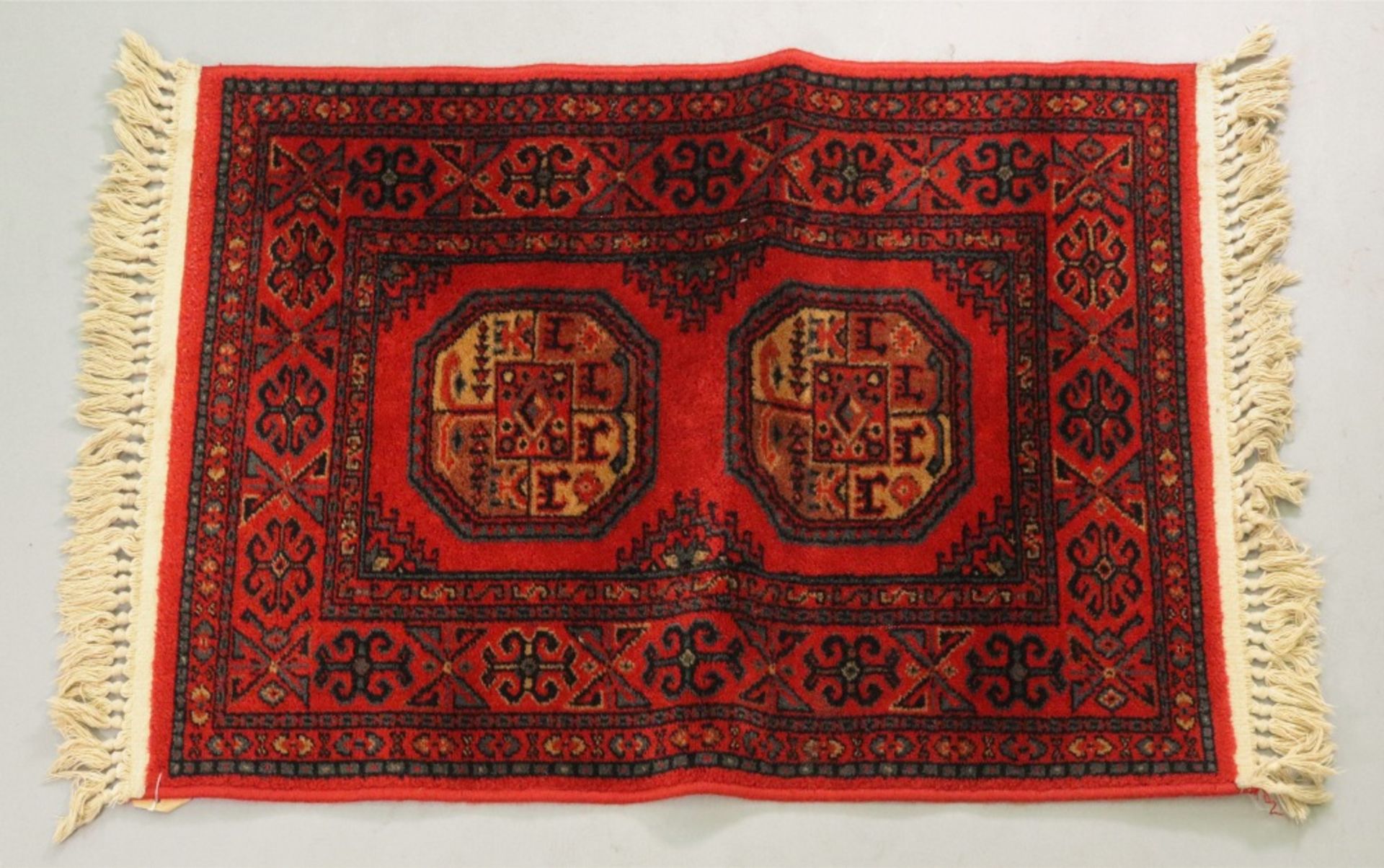 A Caucasian rug, with a Lesghi star design, on a cream and red ground, - Image 2 of 2