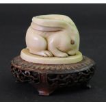 A Japanese marine ivory figure of a hare, Meiji period, modelled crouching with ears pinned back,