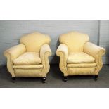 A pair of early 20th century patterned yellow upholstered easy armchairs on squat square cabriole