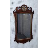 An 18th century figured walnut parcel gilt fret cut pier glass with Prince of Wales feather crest,