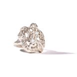 A diamond ring, in a pierced scrolling, floral and foliate design,