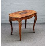 A Victorian gilt metal mounted marquetry inlaid figured walnut centre table, with shaped oval top,