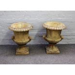 A pair of reconstituted stone jardinieres, with egg and dart rims and scroll handles,