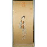 Chinese school,. 20th , a painting on silk of a young woman standing holding a stick, signed, 96cm.