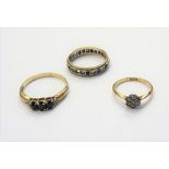 A gold and diamond set seven stone cluster ring, mounted with cushion shaped diamonds,