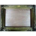 An early 20th century gilt plaster frame, a folio containing four modern prints,