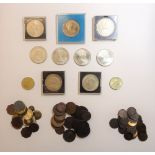 A collection of British coins, including some pre-decimal, pre-1947 issues, contained in an album,