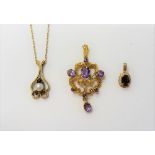 A 9ct gold, amethyst and seed pearl set pendant, in a scroll pierced openwork design, a 9ct gold,