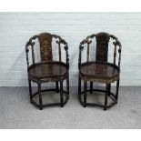 A pair of late 19th century Chinese black lacquer chinoiserie decorated side chairs,