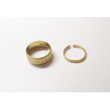 A 22ct gold wide band wedding ring, with faceted decoration, London 1969,
