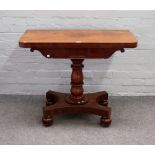 An early 19th century mahogany tea table,