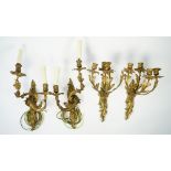 A pair of rococo style gilt bronze two branch wall appliques, 19th century, with foliate cast arms,