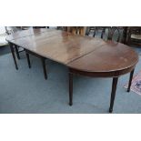 An 18th century mahogany extending dining table with central drop flap section,