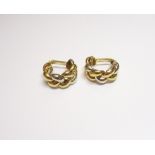 A Poiray pair of two colour gold earclips, each of curved plaited design, details Poiray 750,