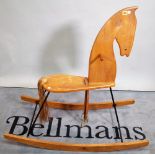 A 20th century elm rocking horse, 113cm wide x 109cm high.