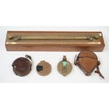 A brass rolling rule by W.H. Harling, London in a mahogany case, 46.