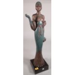 A faux bronze Art Deco type figure on plinth base, 67cm high.