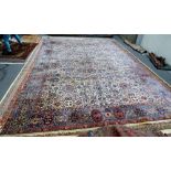 An Esfahan carpet, the ivory field with an allover palmette and floral spray design,