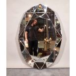 A modern oval geometric pattern mirror, 80cm wide x 120cm high.