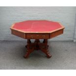 A Victorian Gothic revival oak octagonal centre table with four dummy and four true drawers on