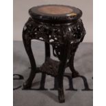 A 20th century hardwood jardiniere on marble stand with inset top, 34cm wide x 50cm high.