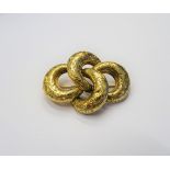 A Victorian gold brooch, in a four section crescent shaped design,