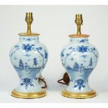 A pair of Dutch Delft blue table lamp vases,