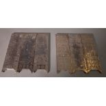 A set of three 20th century Chinese white metal scroll weights, framed as screen panels,