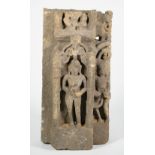 An Indian stone fragment, 11th century, carved with Parvati standing in a niche,