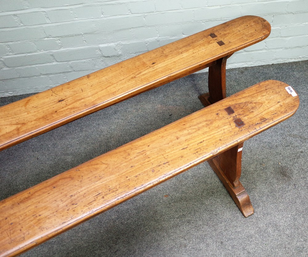 A pair of 19th century French fruitwood benches on silhouette trestle supports, - Image 2 of 3