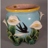 A Victorian style ceramic jardiniere with moulded floral decoration, 23cm wide x 27cm high.