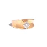 A gold and diamond single stone ring, claw set with a circular cut diamond, detailed 14 K,