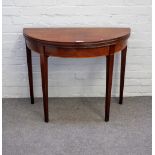 A George III mahogany tea table, the semi-elliptic fold out top on tapering square supports,