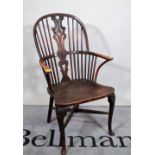 A 19th century yew wood backed Windsor armchair, 63cm wide x 106cm high.