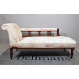 An early 20th century mahogany framed chaise longue, on ring turned supports,