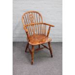 A 19th century ash and elm bow back Windsor chair on turned supports, 58cm wide x 88cm high.