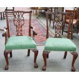 A set of twelve 18th century style mahogany dining chairs with pierced splat back on claw and ball