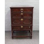 A 17th century and later oak chest on stand,