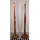 A pair of 20th century mahogany standard lamps, on circular plinth bases, 160cm high, (2).