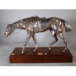 An early 20th century silver plated model of a horse on a oak rectangular plinth base,