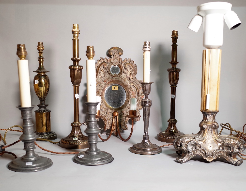 A group of seven assorted decorative table lamps including silver plated and pewter examples and a