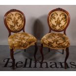 A set of six Victorian walnut upholstered ballon back dining chairs, 45cm wide x 89cm high.