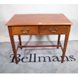 An early 19th century mahogany two drawer side table, on tapering square supports,