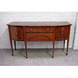 A late George III satinwood banded mahogany bowfront sideboard, with four frieze drawers,