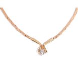 A gold and diamond single stone necklace, claw set with a circular cut diamond to the front,