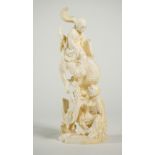 A Japanese ivory okimono of two arhats and a dragon, Meiji/Taisho period, signed, 25cm. high.