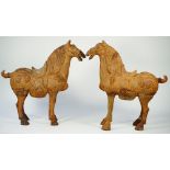 A pair of modern Chinese style Tang horses with rustic patina, 65cm high, (2).