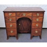 A late George III mahogany kneehole writing desk,